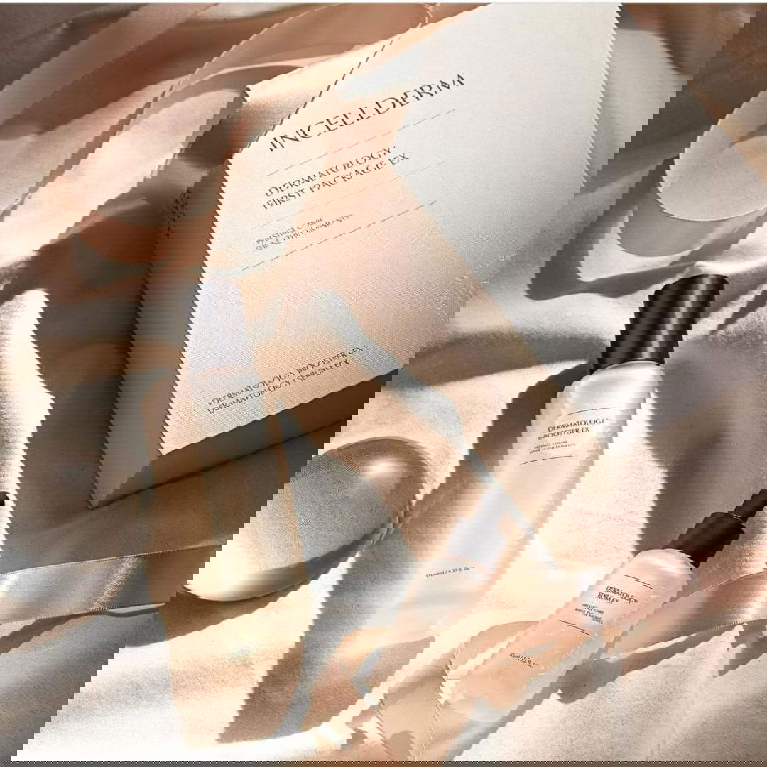 Cosmetic bottles and packaging on a soft fabric background