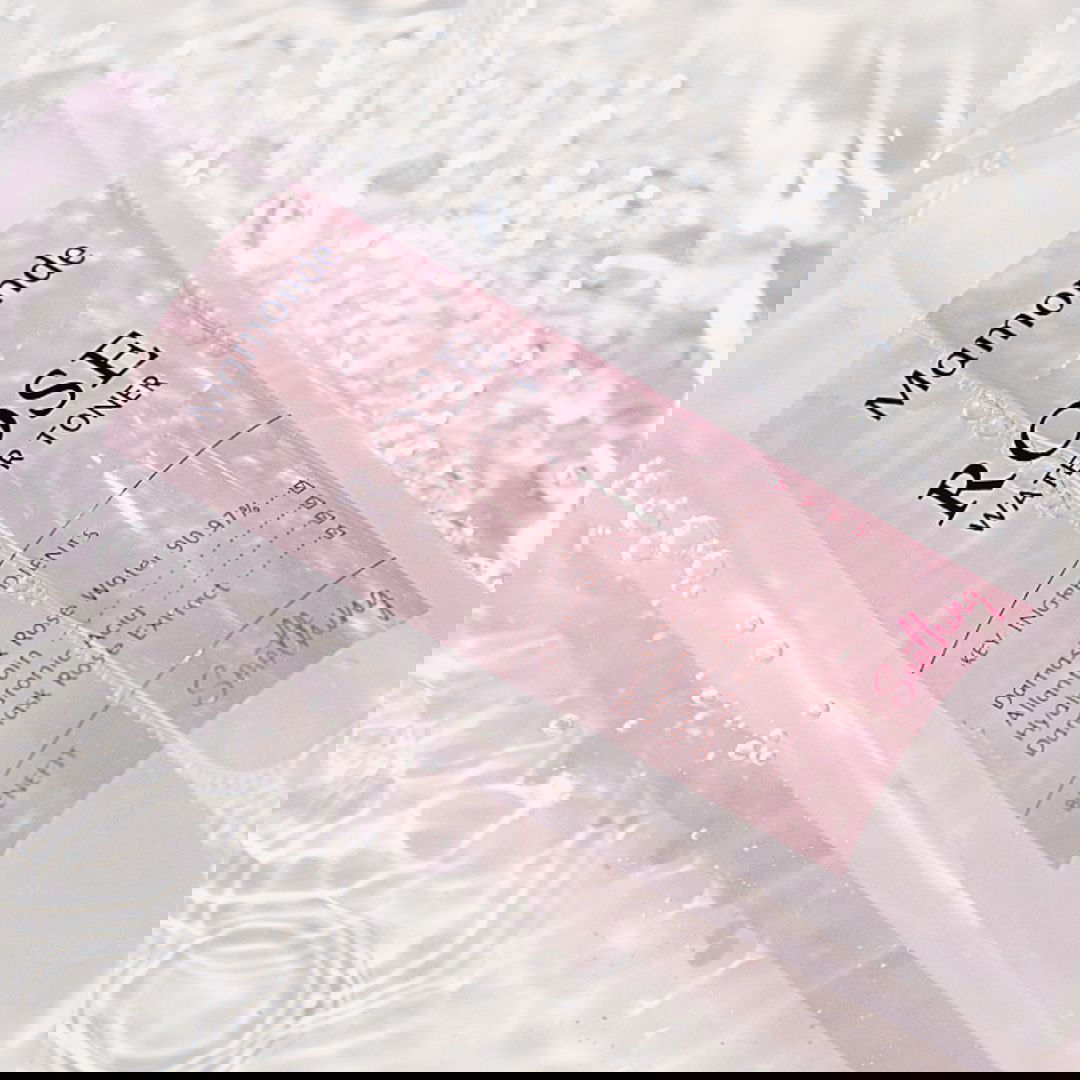 Mamonde Rose Water Toner bottle on a textured white background
