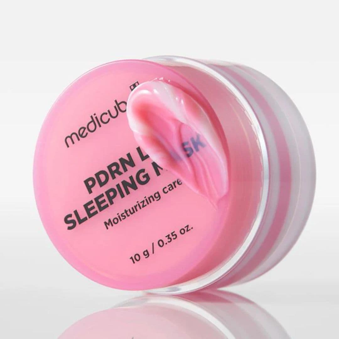 Pink sleeping mask jar with 'medicube' branding on a light gray background