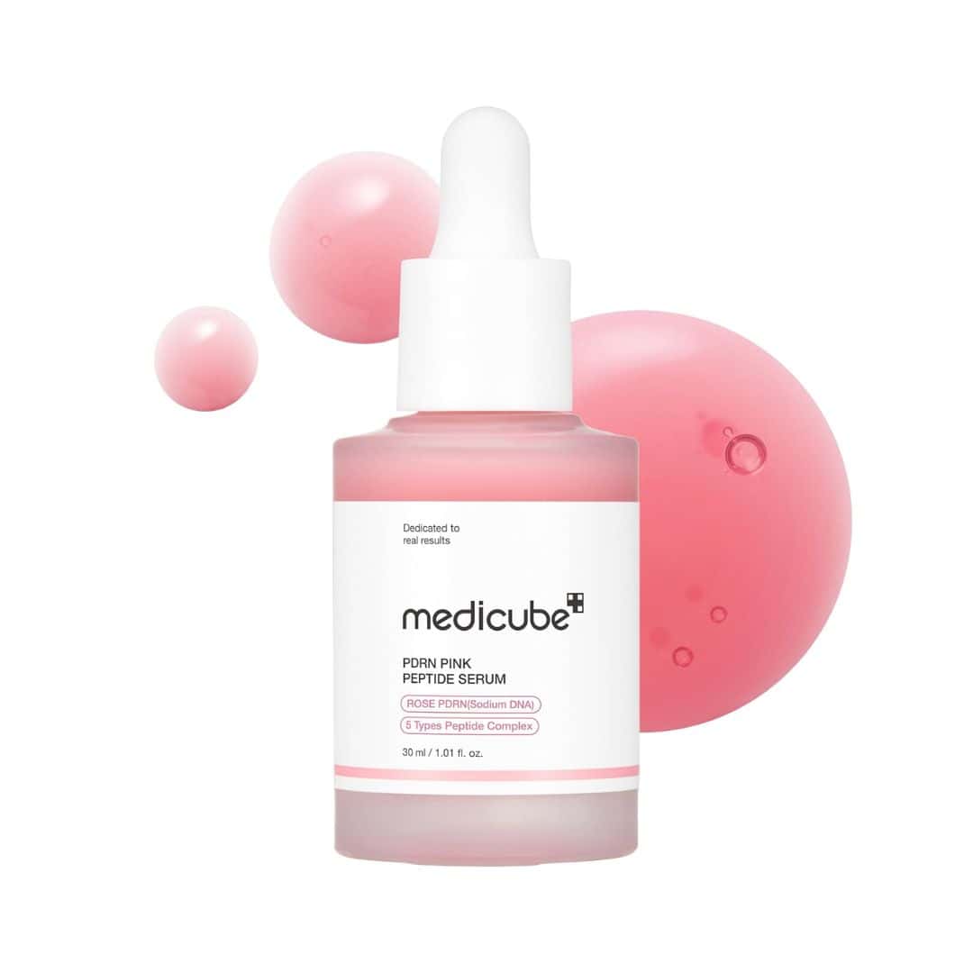 Medicube Pink Peptide Serum bottle with dropper on a white background