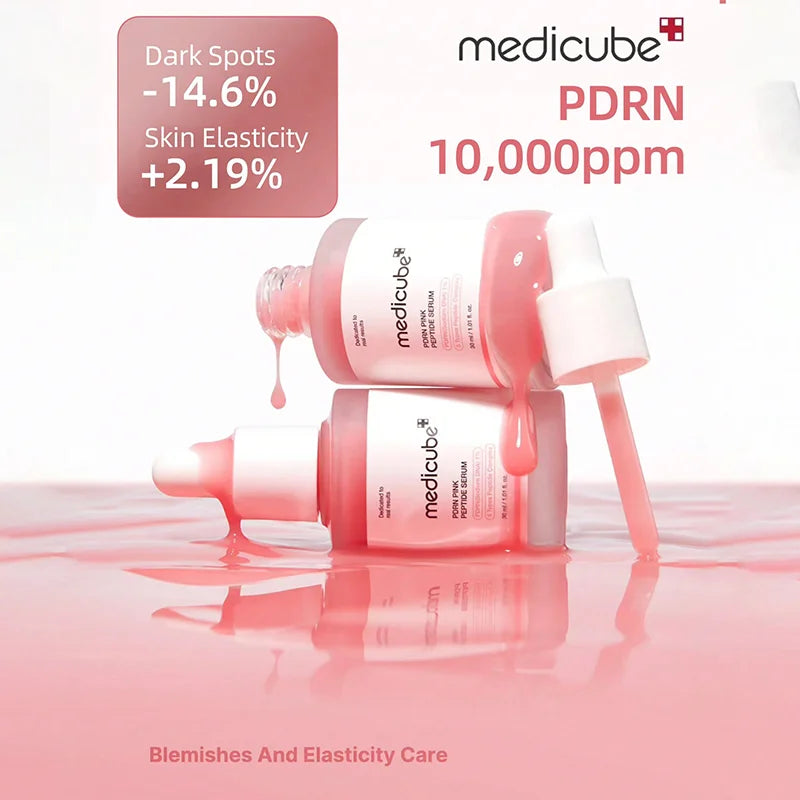 Medicube skincare product with text on dark spots and skin elasticity improvement on a white background.